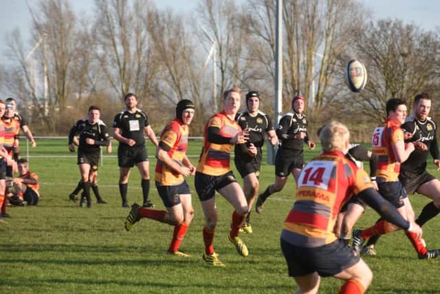 Borough's Joe Andresen tries to get his backs moving against Market Harborough.