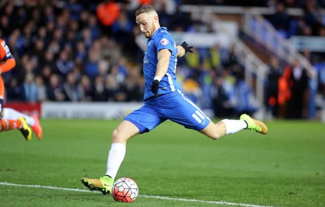 Posh star Marcus Maddison has been watched by Championshop clubs.