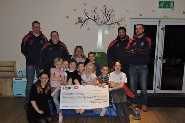 The cheque being handed over