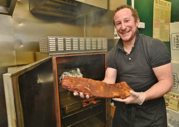 David Beever at Sundays getting the meat ready for the smoker.