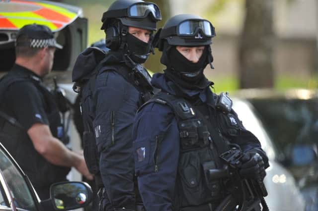 Armed police at the seige at Watergall, Bretton EMN-151020-183014009