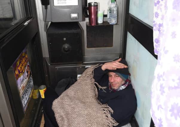 Man living in telephone box at Gladstone Street EMN-160122-100613009