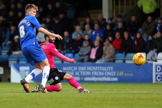 Erhun Oztumer of Peterborough United scores the opening goal of the game. Picture: Joe Dent