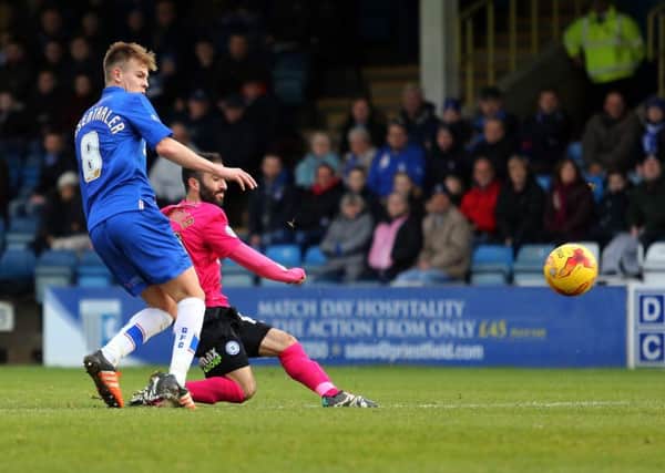 Erhun Oztumer of Peterborough United scores the opening goal of the game. Picture: Joe Dent