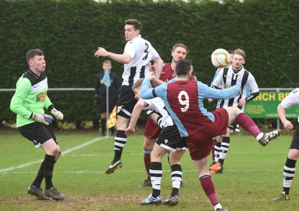 Action from Deeping's 4-2 win over Peterborough Northern Star (stripes). Photo: David Lowndes.