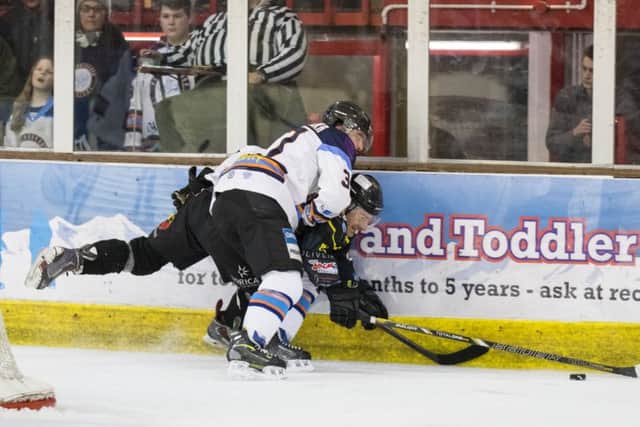 Robbie Ferrara checks Milan Kostourek of Bracknell Bees. Picture: Tom Scott
