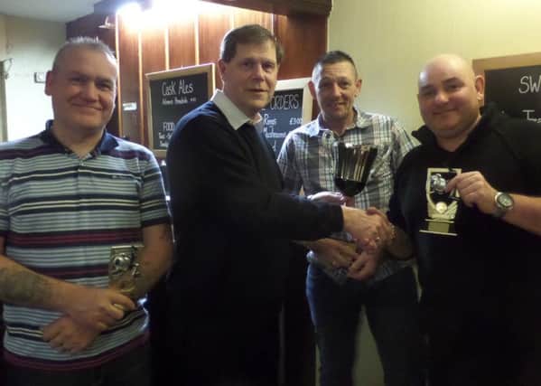Ken Wade presented the prizes at the Cock Inn Angling Club presentation night. Club champion once again was Steve Smith, who took five match wins and two seconds for a total of 191 points. Gary Sell was runner-up position with 181 (1 win and 7 seconds) followed by Bob Mills on 178 (4 wins and 1 second). From the left are Gary Sell, Ken Wade, Bob Mills and Steve Smith.