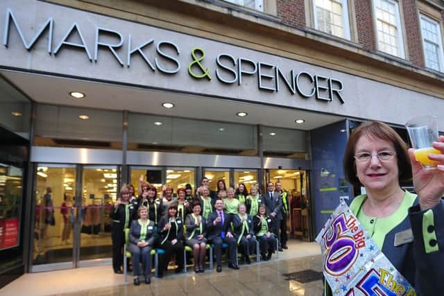 New users being lined up for the Marks & Spencer Bridge Street store, where staff last year celebrated  50 years since the store's opening.  Pictured is  men's wear assistant Margaret Porter who started  in the store the day it opened. EMN-140603-083917001