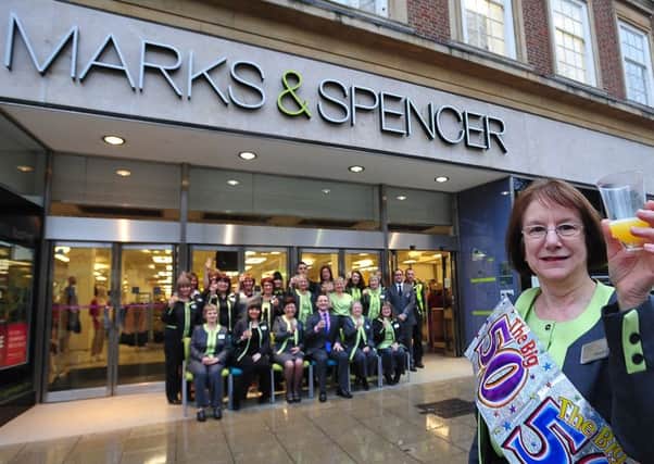 New users being lined up for the Marks & Spencer Bridge Street store, where staff last year celebrated  50 years since the store's opening.  Pictured is  men's wear assistant Margaret Porter who started  in the store the day it opened. EMN-140603-083917001
