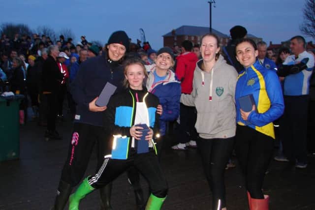 Peterborough City Rowing Clubs Womens Novice coxed four celebrate their win at Boston.