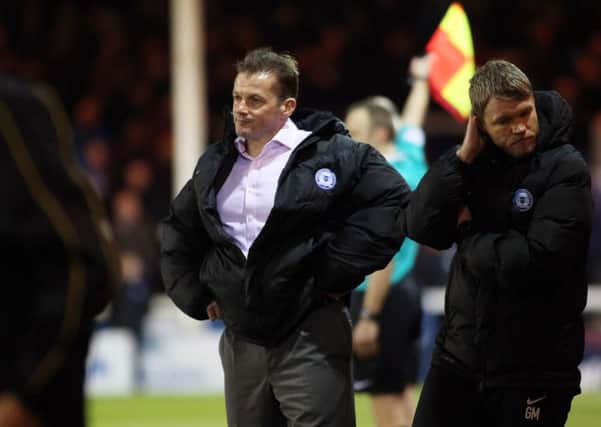 Posh boss Graham Westley and his assistant Grant McCann are clearly not impressed with what they are watching against Burton. Photo: Joe Dent/theposh.com.