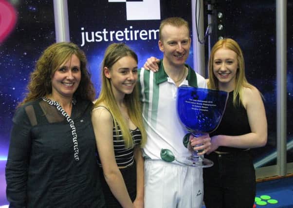 Nicky Brett celebrates his world title win with wife Sam and daughters Lauren and Chloe. Picture: Dominic Picksley