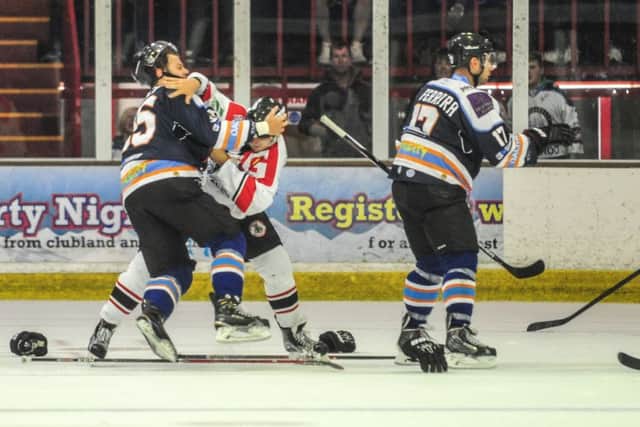 Greg Pick tussles with Basingstoke's  Joe Rand.