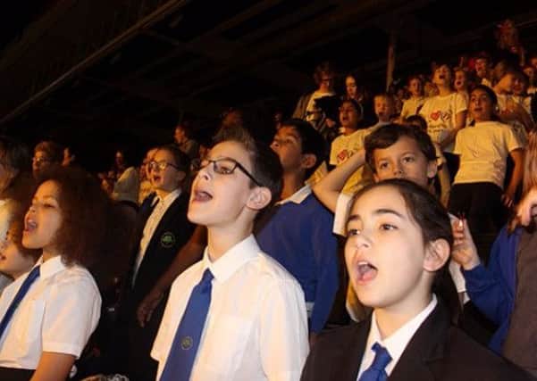 Pupils singing in the choir