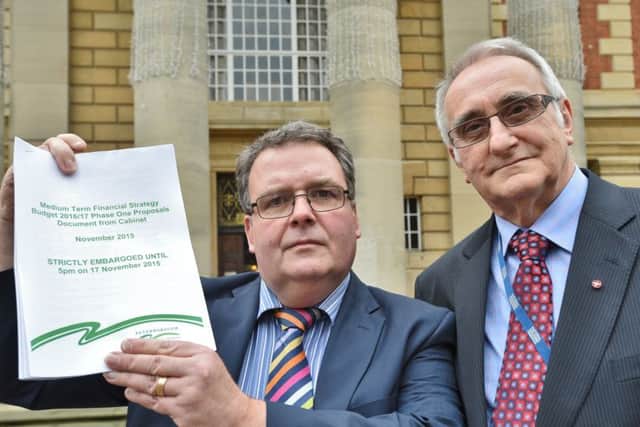 Councillors David Seaton and John Holdich with the budget proposals for PCC EMN-151117-162521009