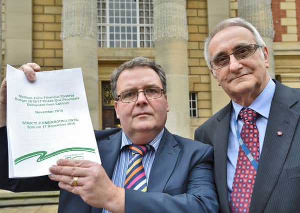 Councillors David Seaton and John Holdich with the budget proposals for PCC EMN-151117-162521009