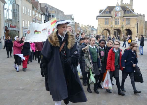 Commemoration service for Katharine of Aragon at Peterborough Cathedral.  Children processing through the city centre on the way to the Cathedral EMN-160129-133020009
