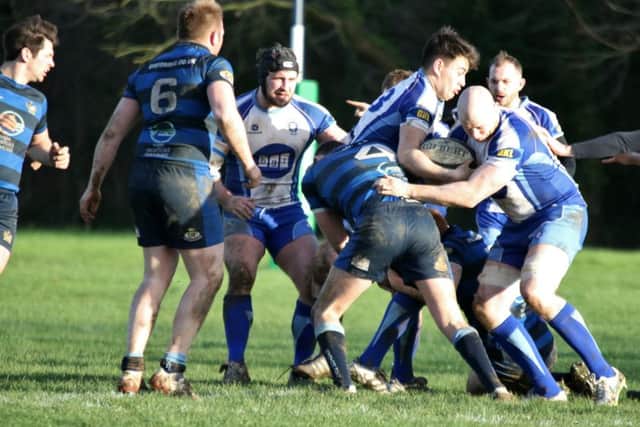 Pete Kolakowski (right) in action for the Lions against Syston. Picture: Mick Sutterby