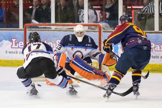 Janis Auzins saves from Guildford's Jens Eriksson. Picture: Tom Scott