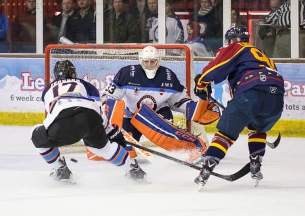 Janis Auzins saves from Guildford's Jens Eriksson. Picture: Tom Scott