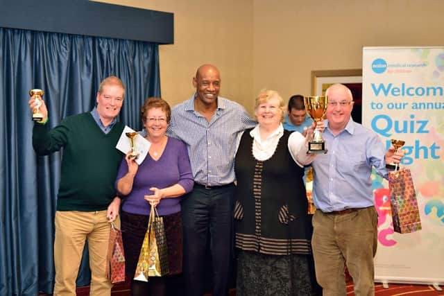 The Chase star Sean Wallace, centre, at one of the charitys quizzes