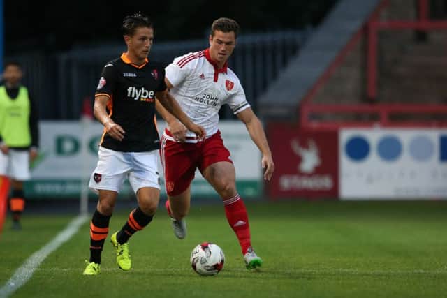 Tom Nichols has signed for Posh from Exeter.