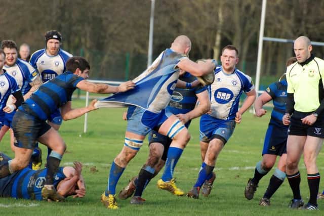 Syston get shirty with Lions powerhouse Marius Andrijauskas. Picture: Kevin Goodacre