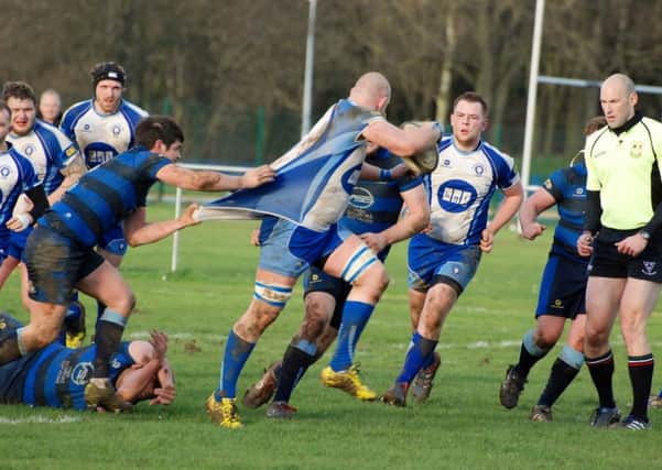 Syston get shirty with Lions powerhouse Marius Andrijauskas. Picture: Kevin Goodacre