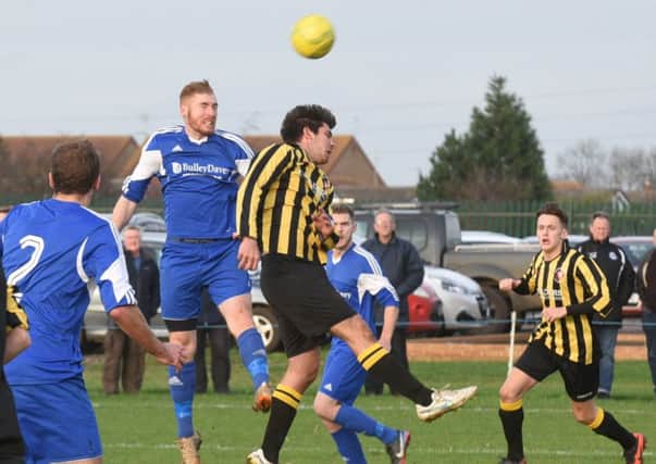Action from the last meeting between Whittlesey Athletic and Moulton Harrox.