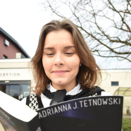 St John Fisher student Adrianna Tetnowski with her book EMN-160302-163622009