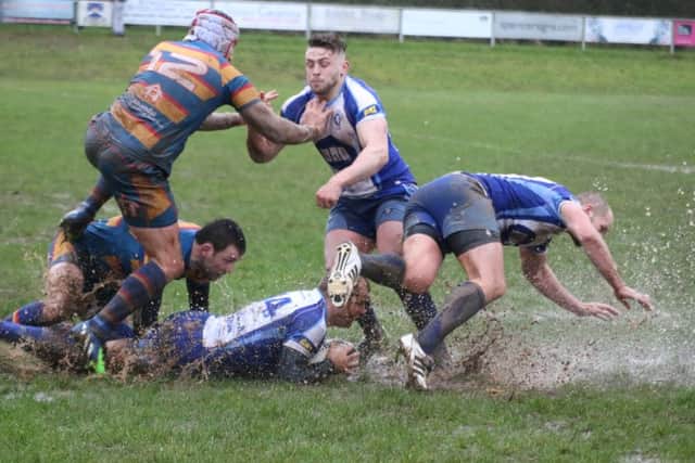 Lions try to make headway on a waterlogged Old Halesonians pitch. Picture: Mick Sutterby