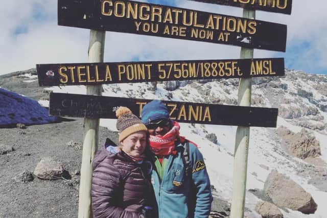 Amy Valentine on top of Kilimanjaro