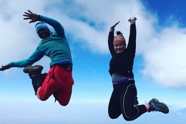 Amy Valentine on top of Kilimanjaro
