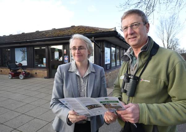 Clare Freeman, head of landscape at the Nene Park Trust with conservation officer Chris Park looking over the new trail guide at Ferry Meadows EMN-160902-192801009