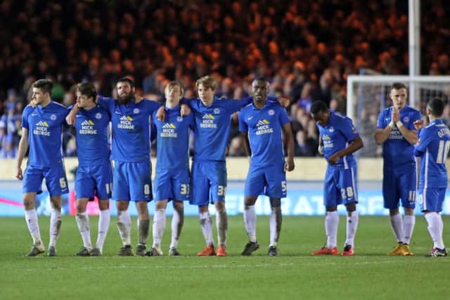 Posh players stand together as their exit from the FA Cup is confirmed. Photo: Joe Dent/theposh.com.