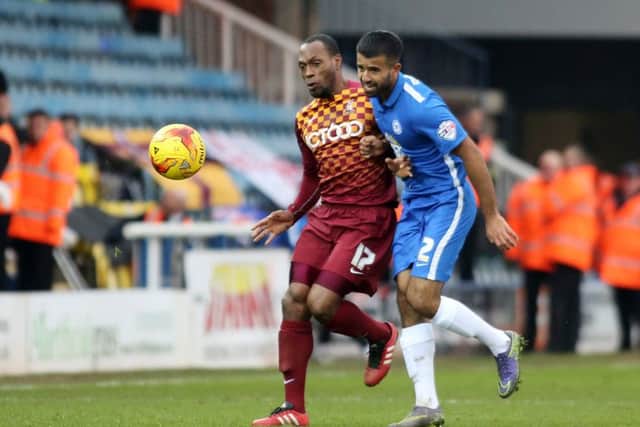 Posh full debutant Adil Nabi battles with Bradford's Kyel Reid. Photo: Joe Dent/theposh.com.