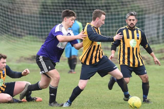 Action fron Bretton North End's 3-2 defeat to Stanground Sports (dark shirts). Photo: David Lowndes.