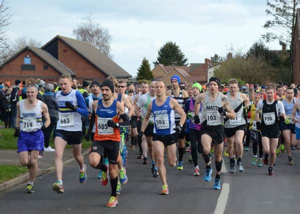 The start of the Stamford Striders 30k race with eventual winner Aaron Scott (685) at the front.
