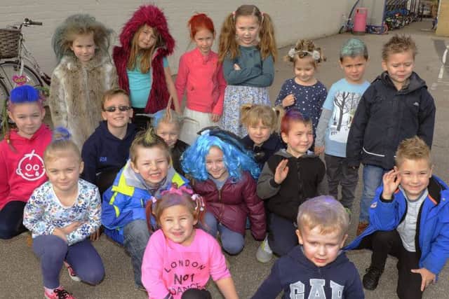 Seven-year-old Ellena Sequerah-Salmon (middle left) joins friends at Burrowmoor Primary School in March for a Bad Hair Day in aid of London's Great Ormond Street Hospital.
