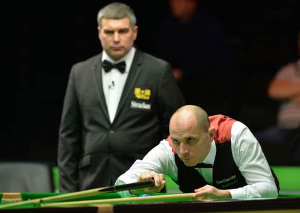 Joe Perry is through to the third round of the Welsh Open in Cardiff.