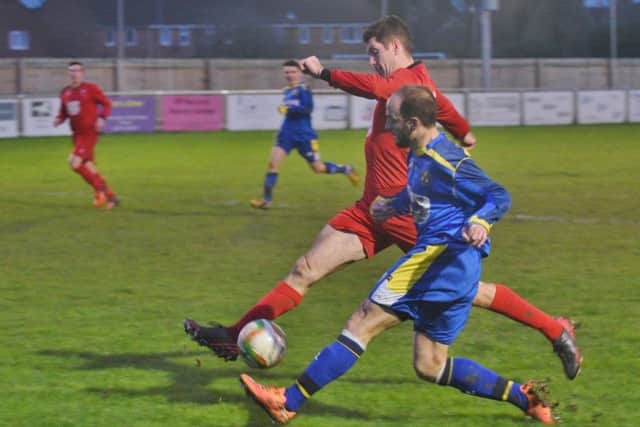 David Cobb (blue) of Peterborough Sports.