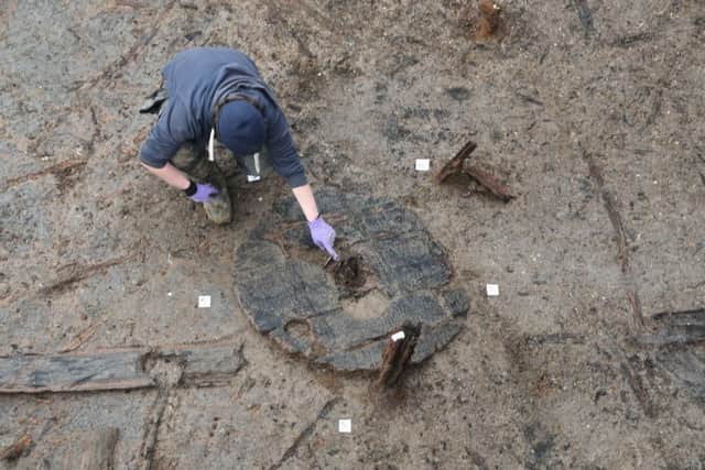 Bronze Age wheel found at Must Farm archaeological dig at Kings Dyke. EMN-160218-132802009