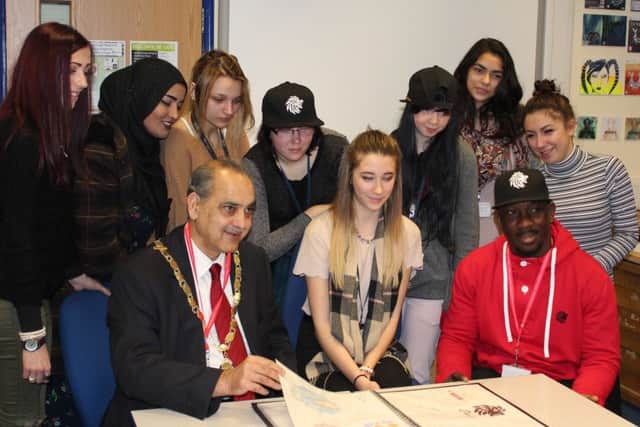 The students with Daniel Dabati and deputy mayor of Peterborough cllr Nazim Khan.