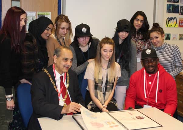 The students with Daniel Dabati and deputy mayor of Peterborough cllr Nazim Khan.