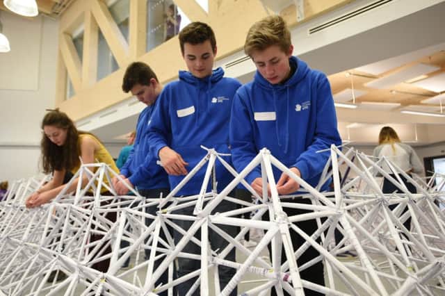 Youngsters working on the giant structure