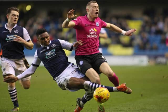 Marcus Maddison of Peterborough United is fouled by Mahlon Romeo of Millwall. Picture: Joe Dent