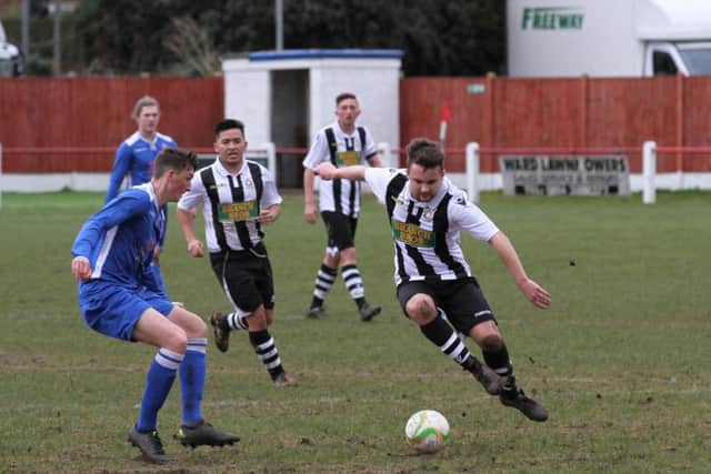 Hayden Bream (stripes) in action for Peterborough Northern Star at Oadby. Photo: Tim Gates.