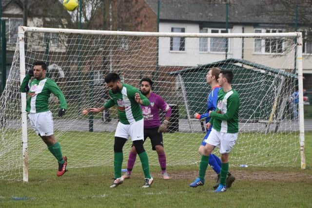 Action from a Peterborough League Division Five match between FC Peterborough Reserves (green) and Parkside Reserves at Fulbridge Road. Parkside won 3-1. Photo: David Lowndes.
