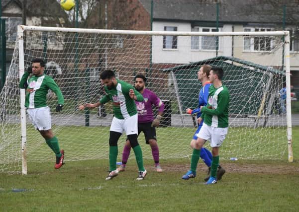 Action from a Peterborough League Division Five match between FC Peterborough Reserves (green) and Parkside Reserves at Fulbridge Road. Parkside won 3-1. Photo: David Lowndes.