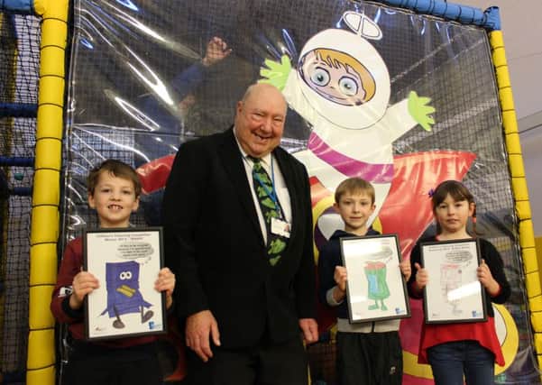 Thomas Reed (left), Cameron Webb and Megan Cooke with Cllr Peter Murphy in the Manor Leisure Centres soft play area
